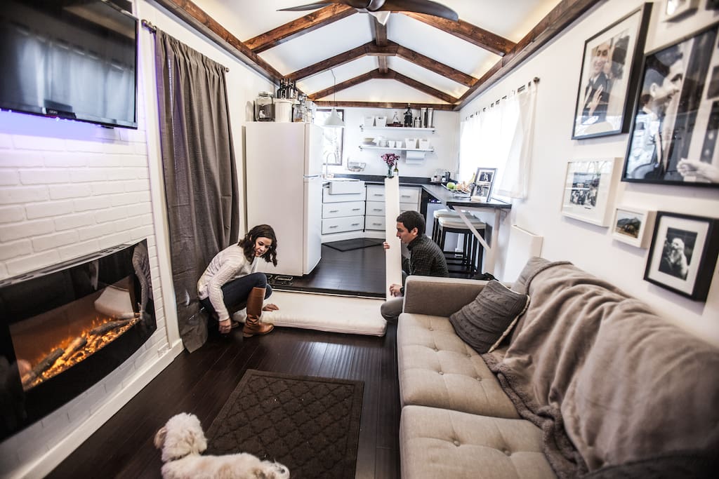 Full size guest bed pulls out from underneath the floor for sleeping, easily slides back in during the day