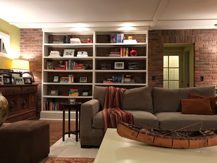 Bookcase adding ambience to brick wall