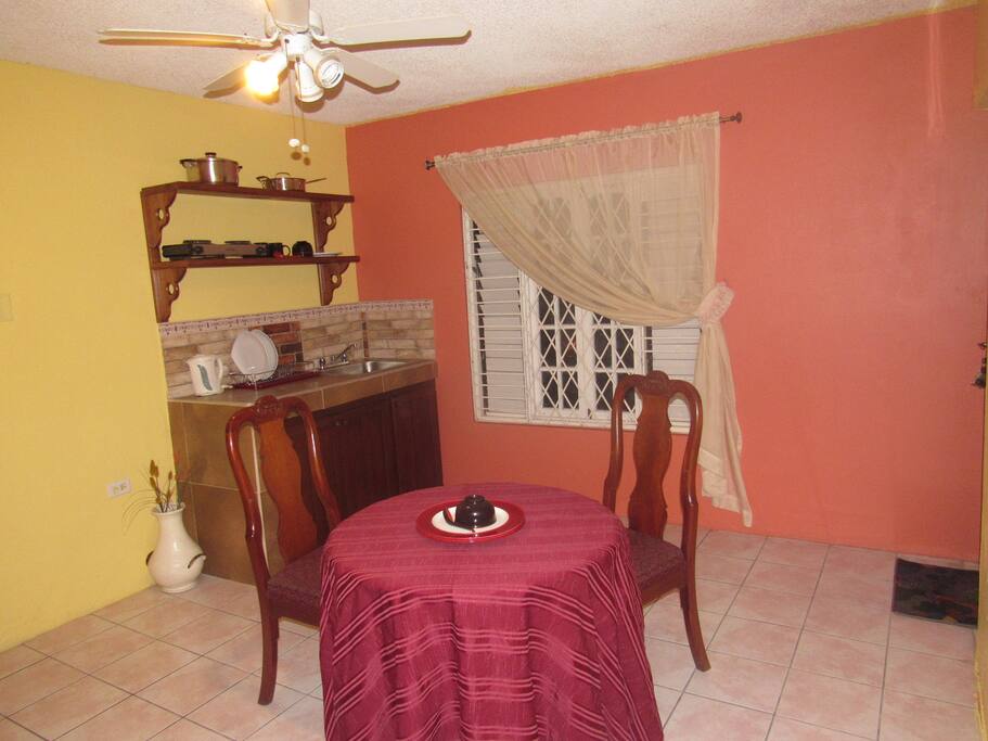 Spacious and comfortable dining and workspace area.