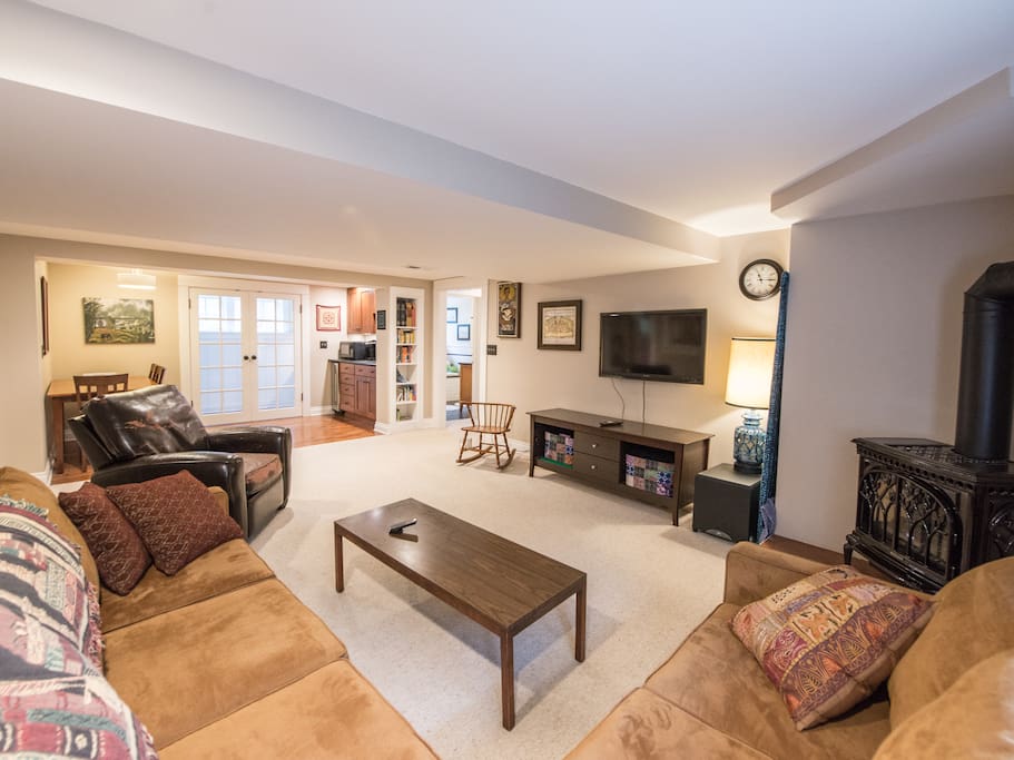 Open floor plan is convenient for watching tv or movies, eating or working at the dining room table. French doors are the end of the apartment. They let in a lot of light.