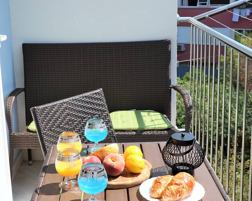 balcony with a view of the green forest