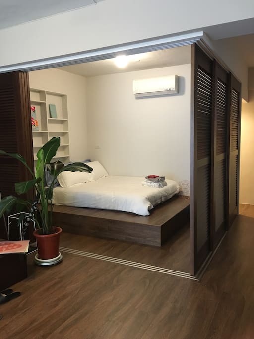 Room no.2 /its an open space with cozy double bed in the livingroom surrounded with sliding doors / **白階房** 有活動式木頭拉門可以四周都拉上
