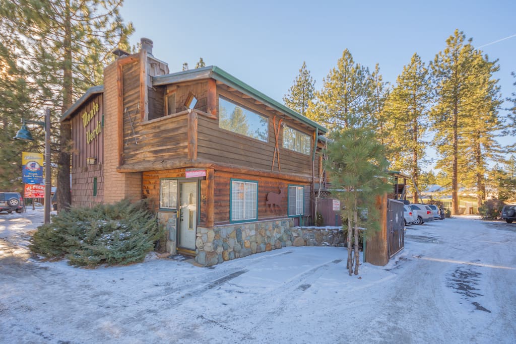 You'll be surrounded by tall pine trees and just across the street from a great coffee shop.