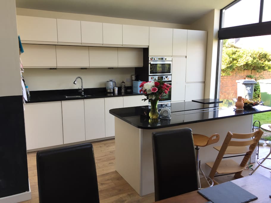 New large space kitchen with induction hob, with full access to large garden