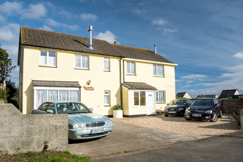 Front of house with ample parking