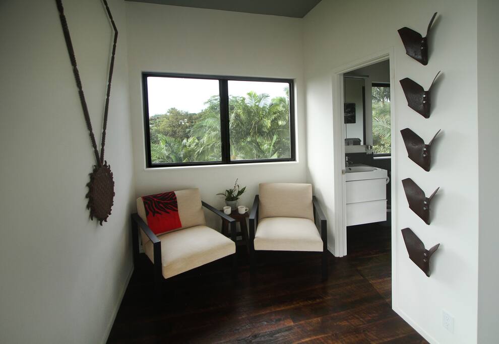 Cacao-Ocean seating area w/ farm inspired artwork.