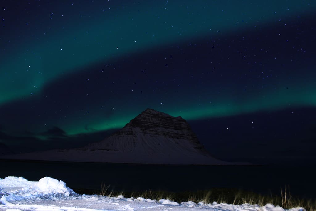 Northern lights over Kirkjufell. Picture taken from our parking lot.