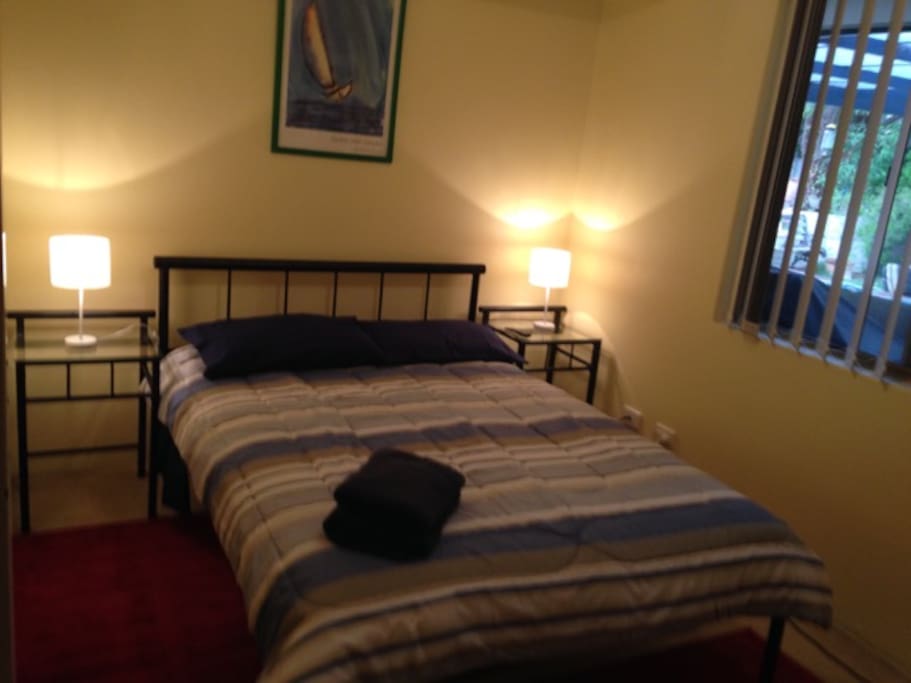 Comfortable double bedroom with garden views.