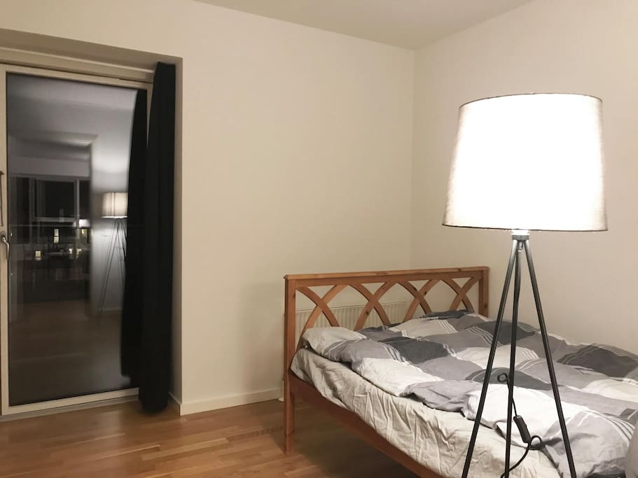 Your bed room with a private balcony door.
