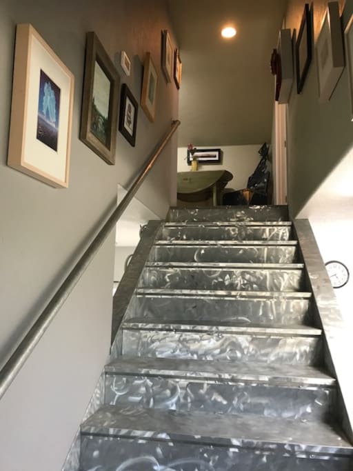 Artsy stairs to loft bedroom with lots of original art to look at, and meet the artist.