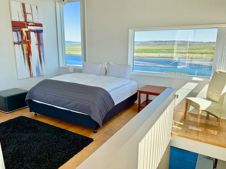 Bedroom 4 - The "penthouse" bedroom - King bed. Blackout curtains, rooftop balcony with panoramic views in all directions.