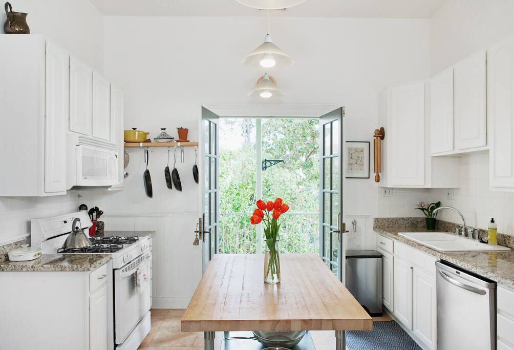 Kitchen doors open up onto sunny back porch