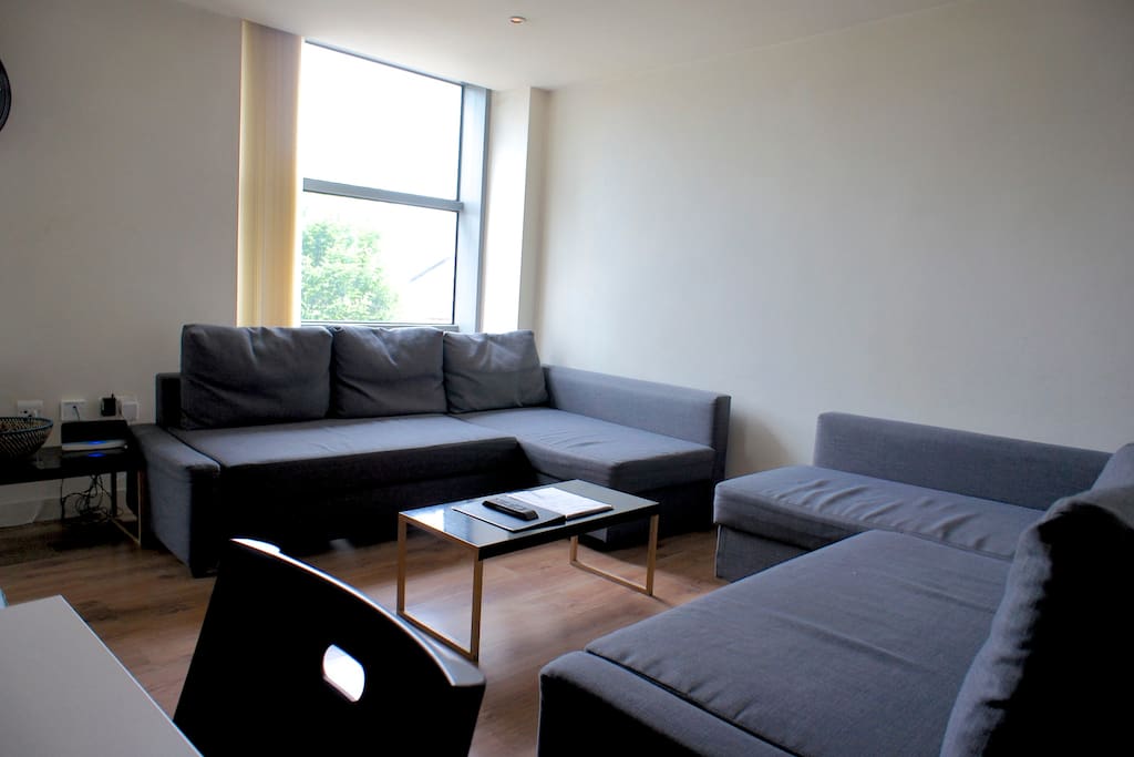 Here's your living room with balcony and two double sofa beds