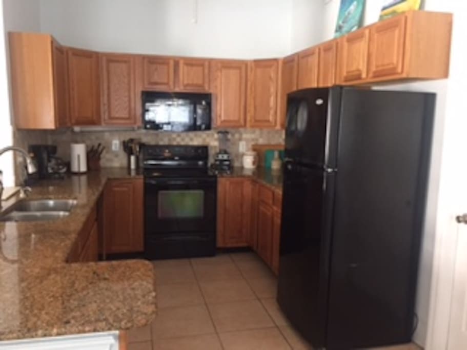Spacious Kitchen and stocked with most kitchen essentials ( BBQ in BackYard)