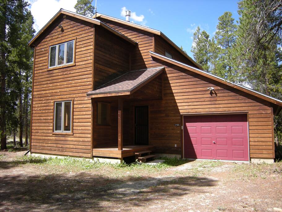 One-car garage with additional parking in front of house