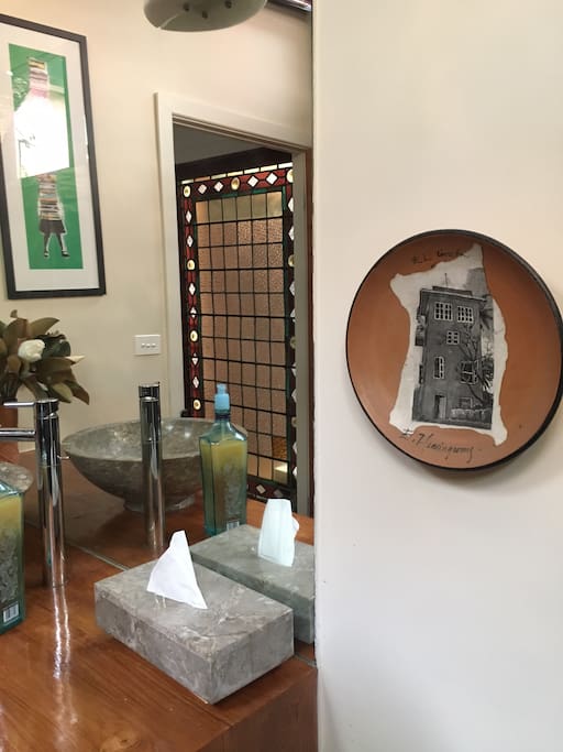 Our house is filled with beautiful things we have gathered on our travels. This is your bathroom. See the Hemingway treasure from Havana? Spot the street art from Buenos Aires?