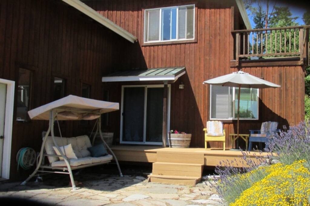 Deck with porch swing and comfy chairs