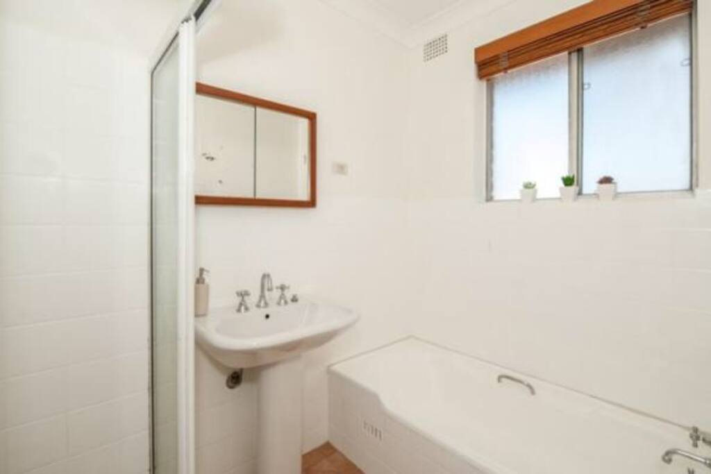 Bathroom with shower and bath
