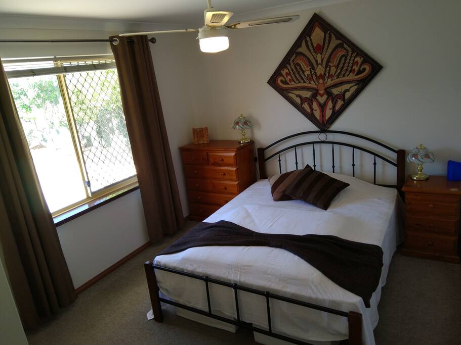 Double bed room with Aircon, Fan and view right out into the pool area.