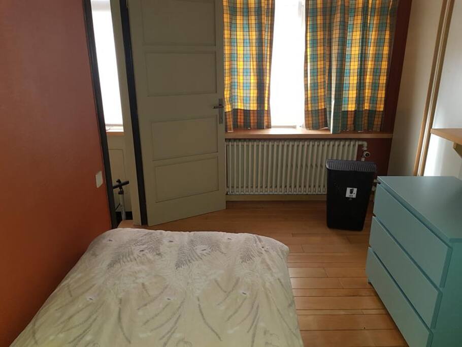 This bedroom is downstairs, and you need to climb one flight of stairs to the toilet, and two flights to both bathrooms