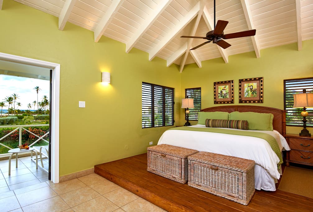This suite features a king-size bed, living room area with pull-out sofa bed, full bath with shower, wet bar and balcony overlooking the ocean.