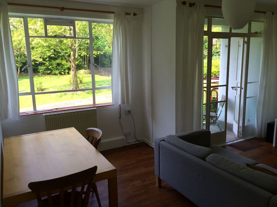 Light and airy dining area with lovely view of trees and gardens