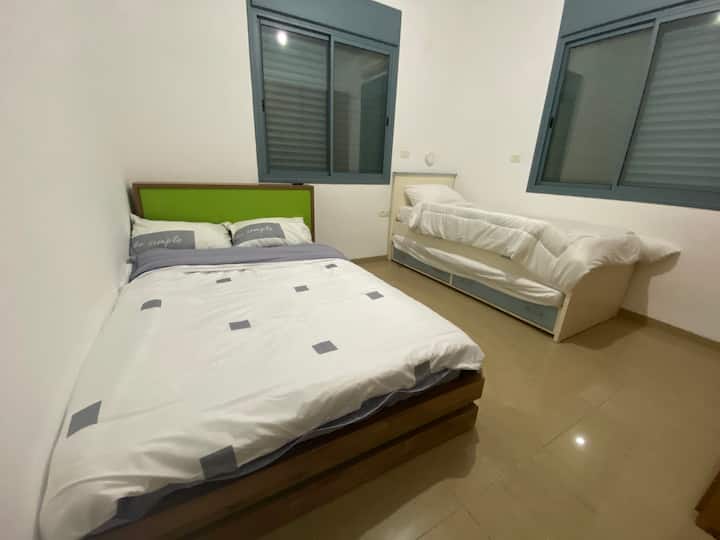 A children's room a bed and a half and a friend's bed