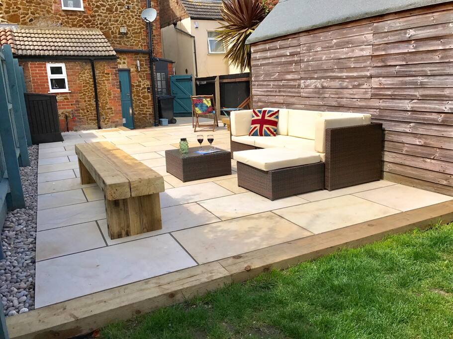 The large modern patio is great for relaxing in the sun with drinks
