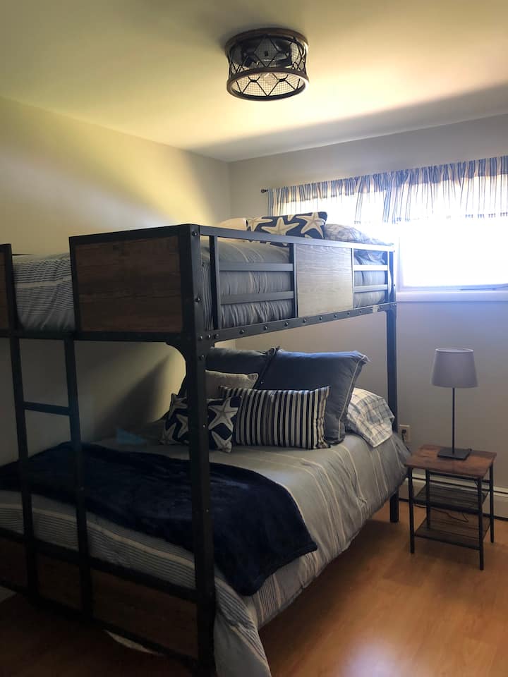 Full over Full bunk beds with new mattresses and linens.