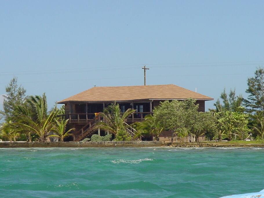 The rear deck looking out to the passing dive boats and mountains on the mainland of Honduras