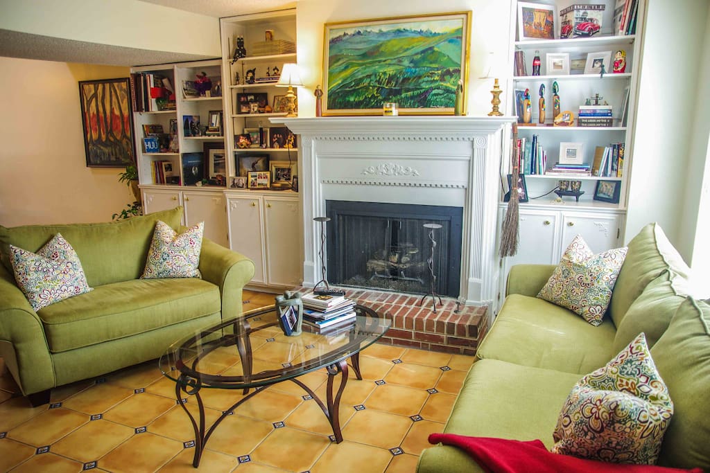 Cozy living room w/ fireplace and Mexican tile throughout