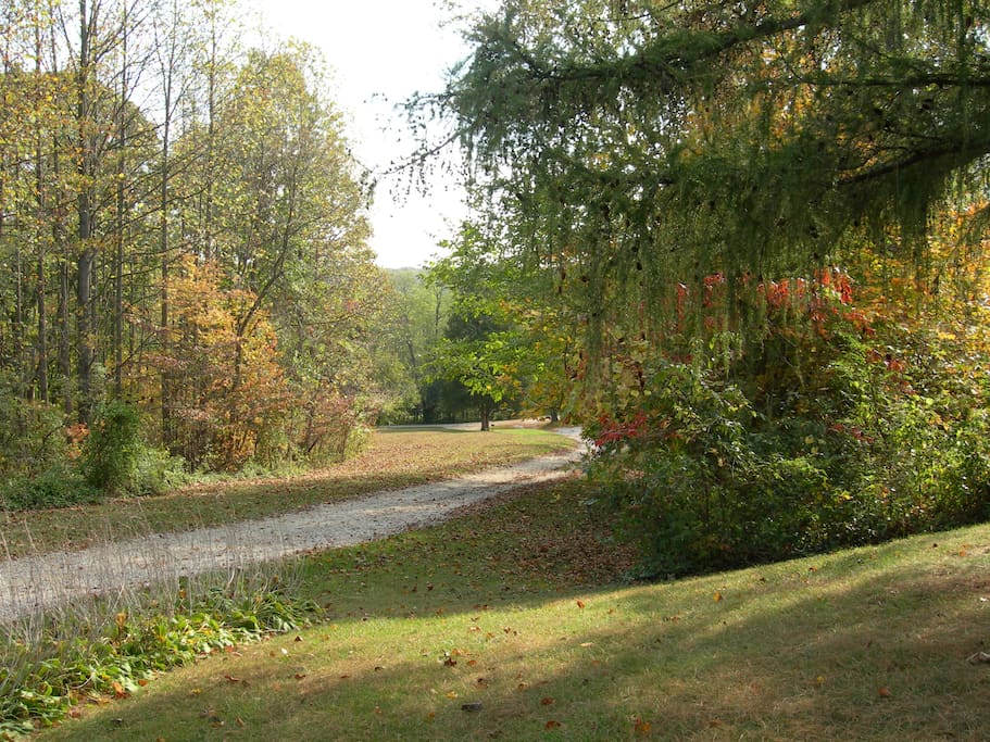A gently sloping gravel drive leads all the way up to the circle drive.
