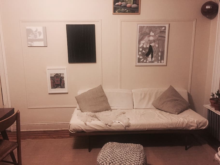 Living room view 1- the couch is a day bed, which can accomodate a third person