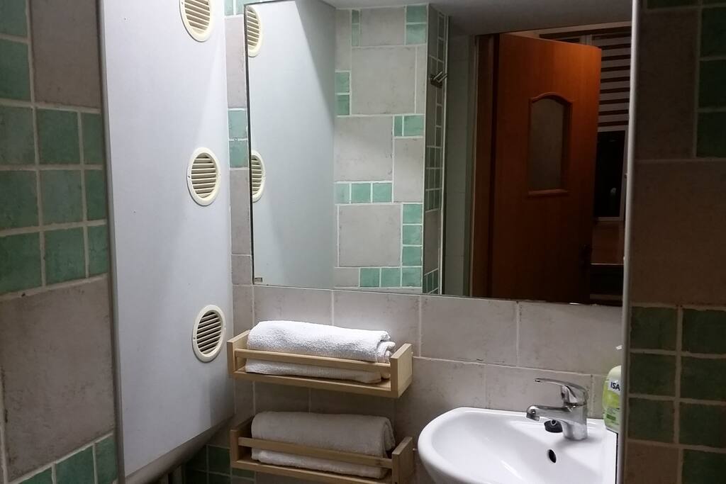 Mini sink for toilet. Towels for guests. Hair dryer