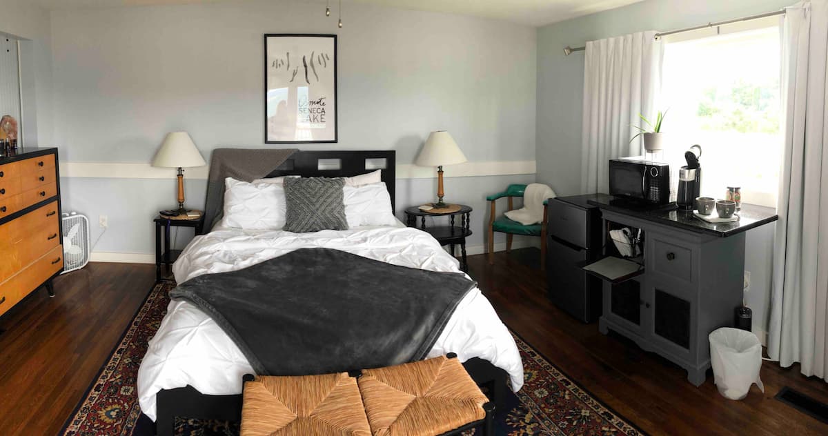 Windows to Seneca — a private guest suite with a deck overlooking Seneca Lake at Osmote