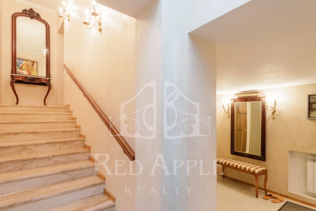 We have a private enter to the building right from the backyard. First level: hallway and loundry. Royal marble stairs to the second level