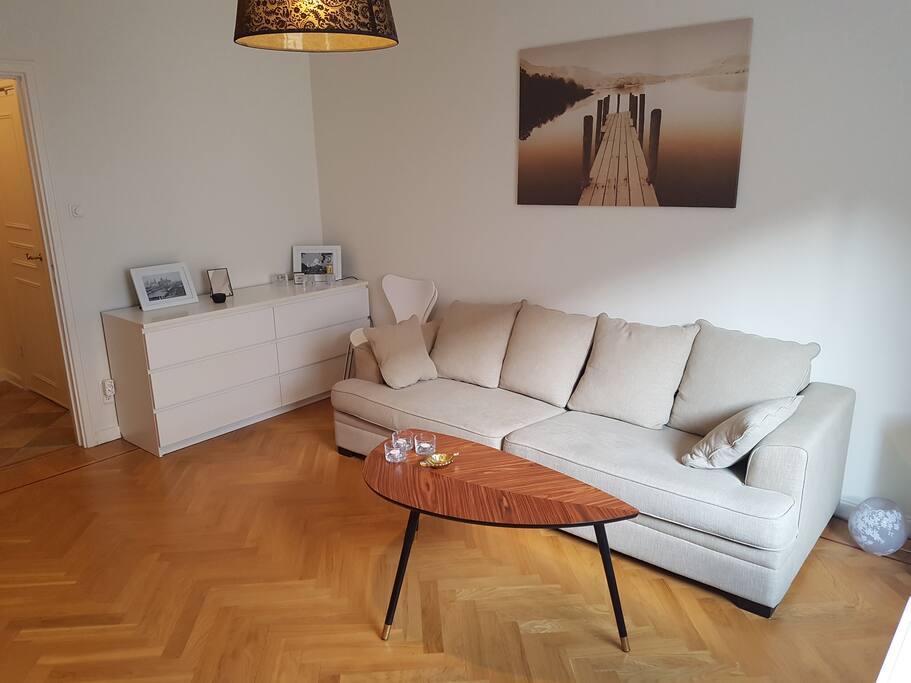 Big comfy sofa and bureau with empty drawers where you can unpack your clothes.