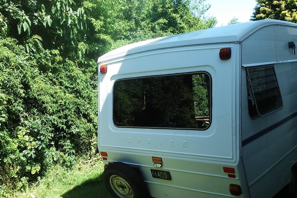 Caravan is located close to the house and far from the street in friendly neighbourhood.