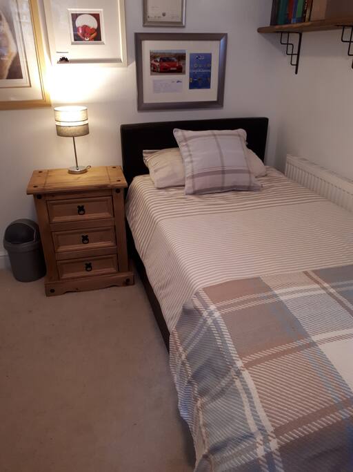bed was originally in this position but we have moved the room around and it's as shown in the other photos.