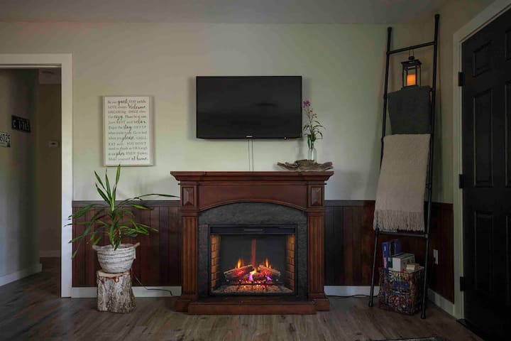 Enjoy cozy fire while watching a movie on the Smart TV, or enjoying the complimentary puzzles, books, games and coloring books. 