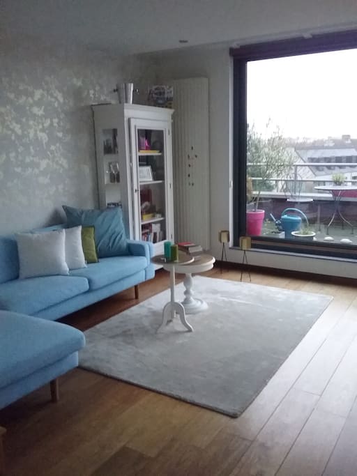 Living room with access to private roof terrace