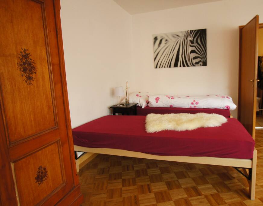 The bedroom consists of two single beds and one sofa-bed.