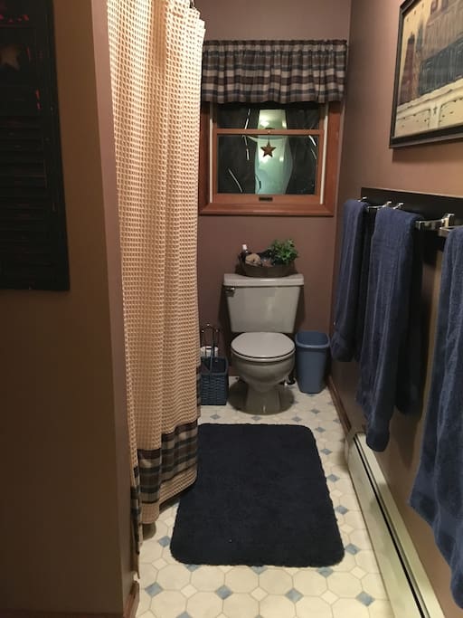 Private bathroom with tub/shower.