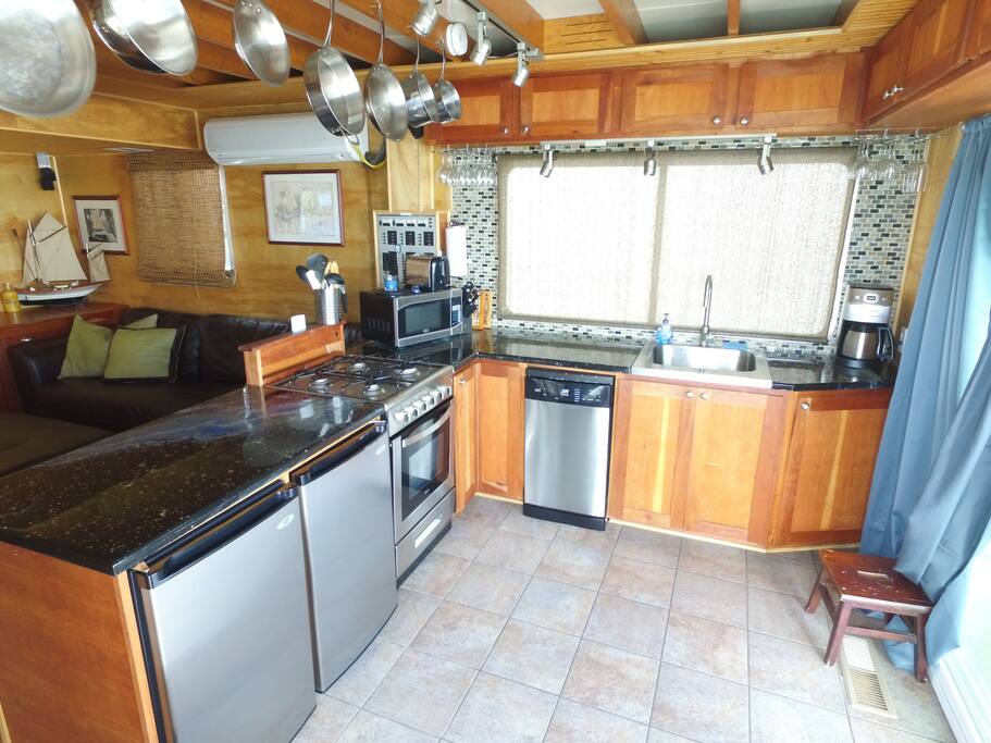 Compact kitchen with cherry cabinets