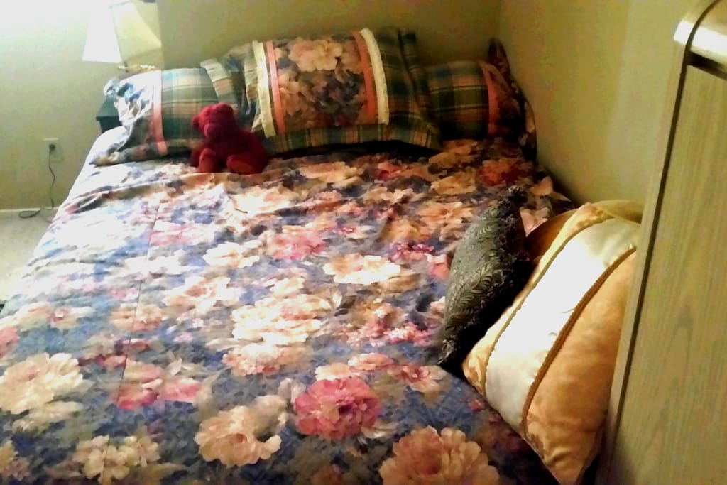 Queen bed, an assortment of pillows with various firmness, and memory foam pad.