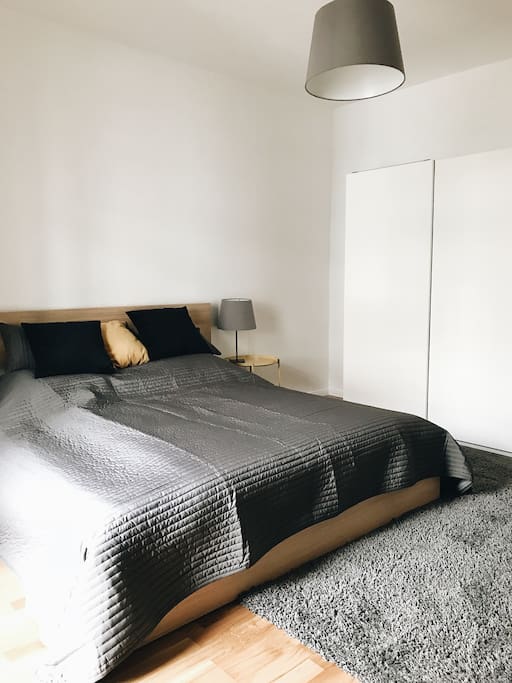 Private bedroom with a 180cm queen-size bed and a balcony