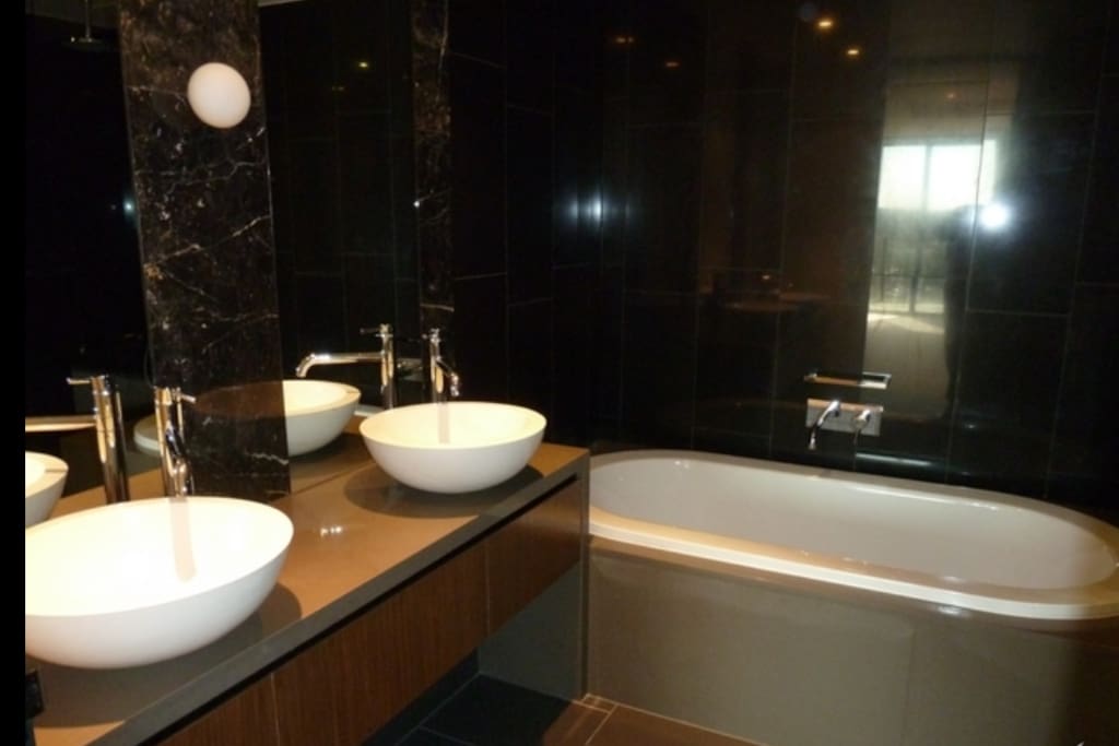 Main bathroom with large bath tab