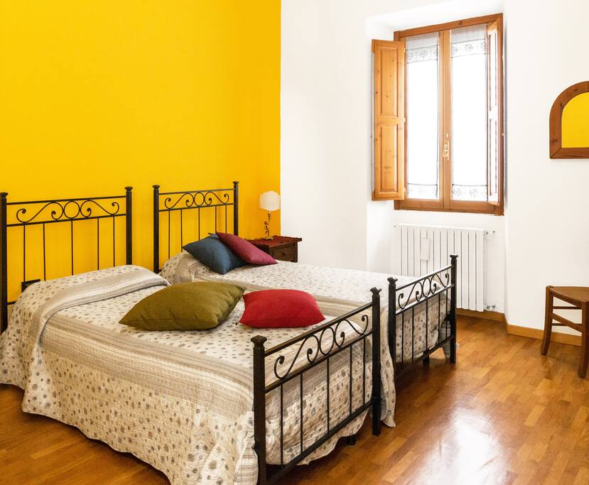 Room with two single beds