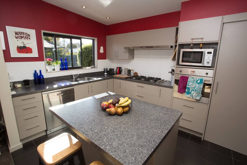 Fully equipped kitchen with 6 burner gas hob.