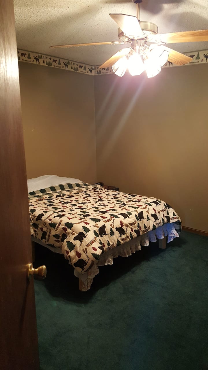 large bedroom, full bed on wood platform 7" memory foam mattress, 2 small night stands, large closet, no windows, has a door for privacy.